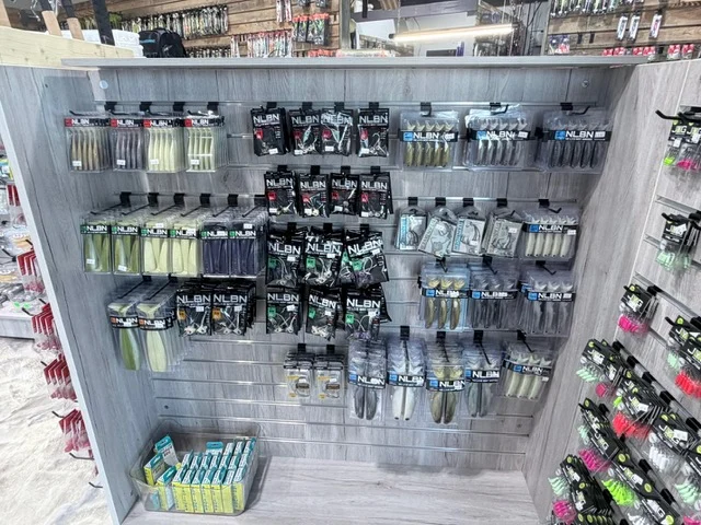 Fishing tackle hanging on a freestanding pegboard