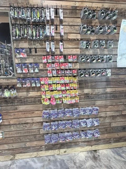Wall of packaged fishing hooks and tackle