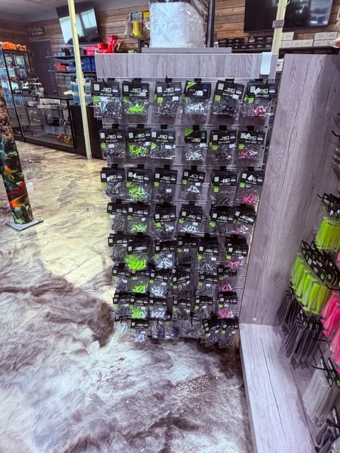 Packaged fishing lures arranged on a display wall