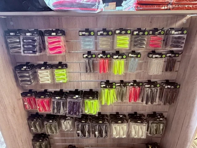 Fishing accessories arranged on a retail pegboard