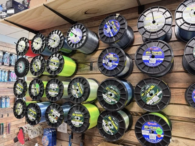 Fishing line spools mounted on the shop wall