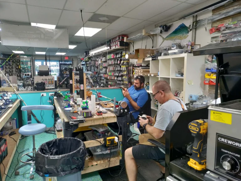 People working around the shop counter and workbench