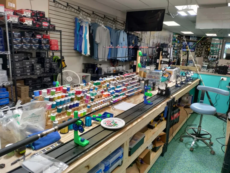 Fishing reel service workbench with tools and equipment