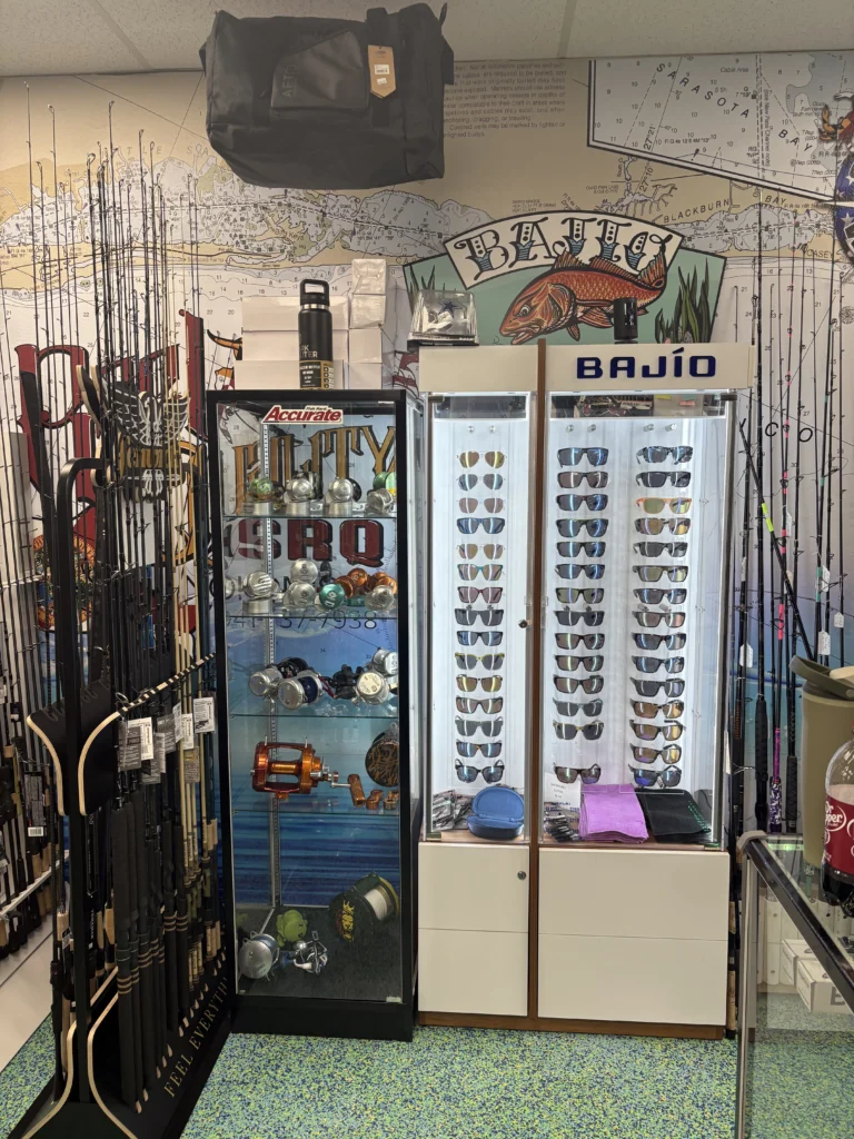 Sunglasses display and fishing rods inside the shop
