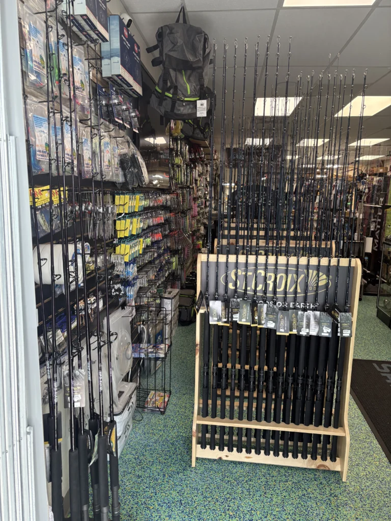 Fishing rod racks beside a retail display