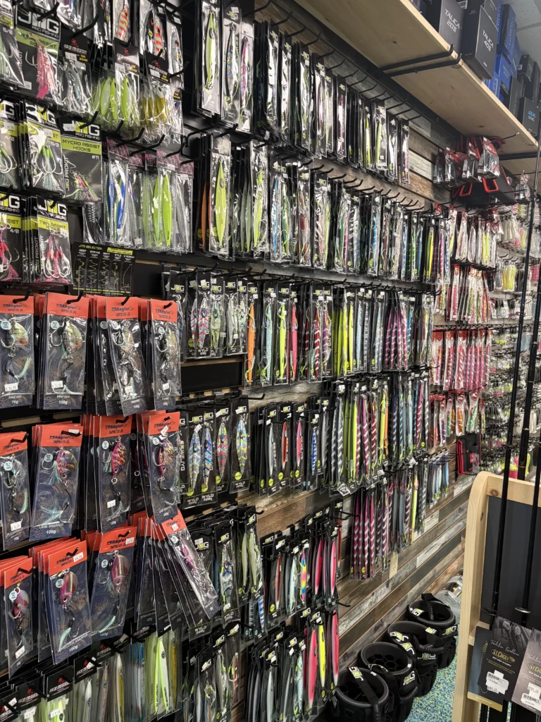Dense wall display of packaged fishing tackle