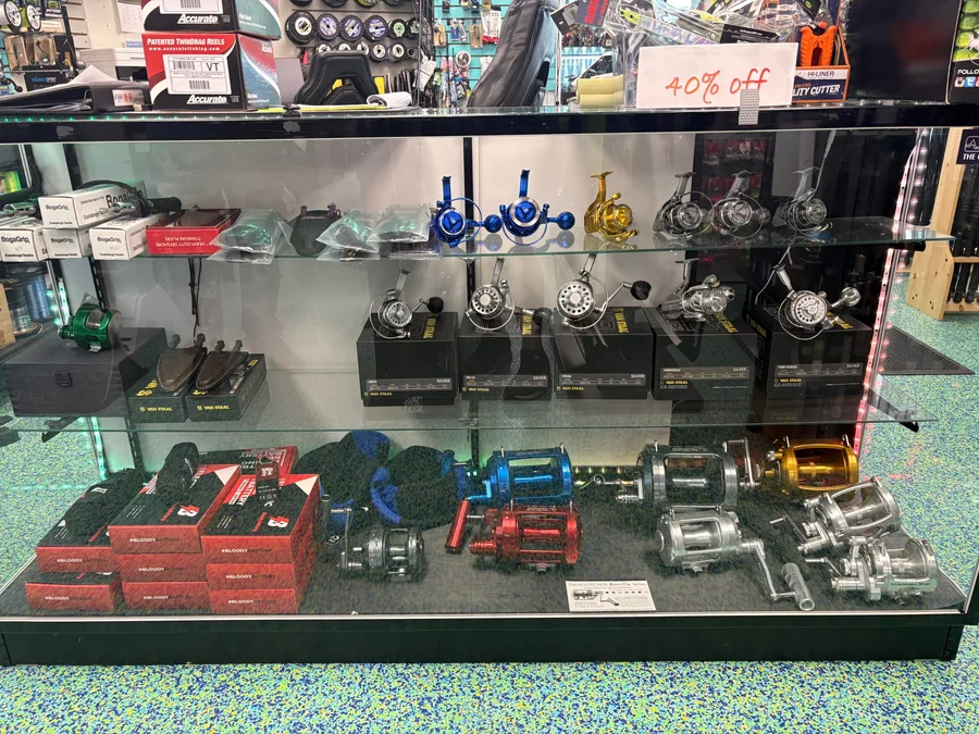 Reel handles, reels, and accessories in the Reel Quality SRQ display case