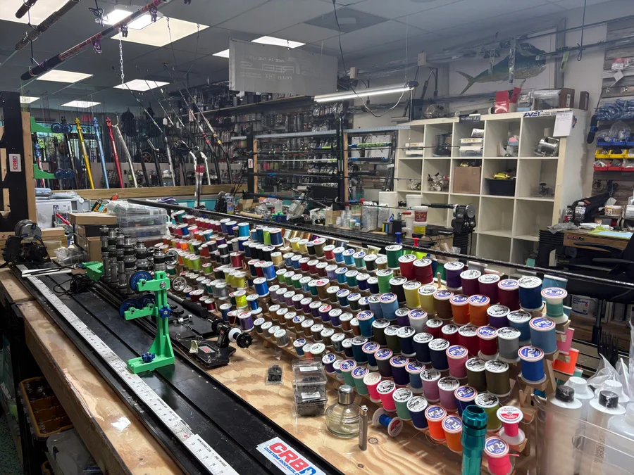 Thread spools and rod-building supplies on the Reel Quality SRQ workbench
