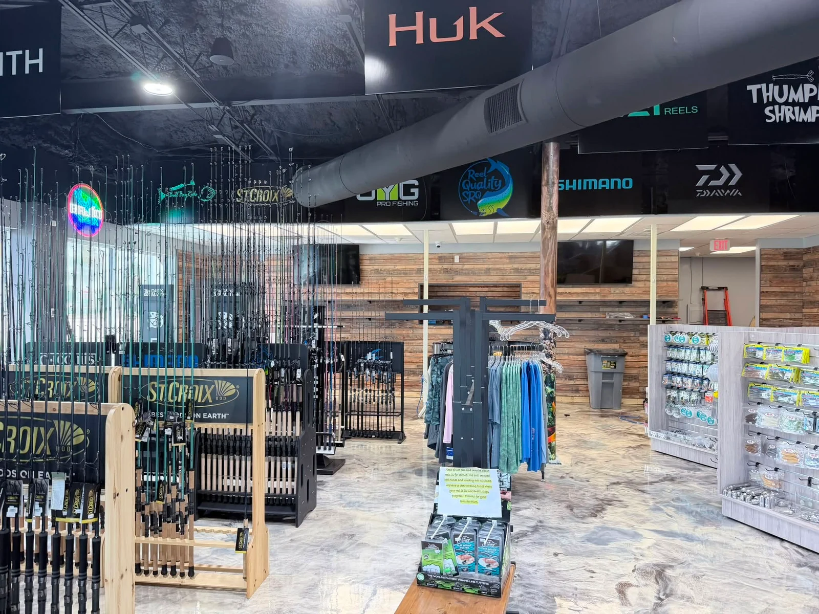 Fishing rods, tackle, and apparel inside the current Reel Quality SRQ shop.